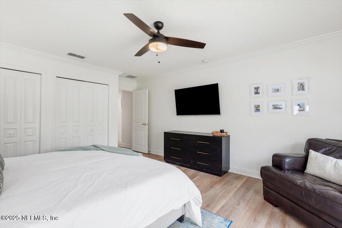 1047 Eagle Point Drive St. Augustine, FL 32092 - Photo 48 of 85 a bedroom with a bed and a flat screen tv