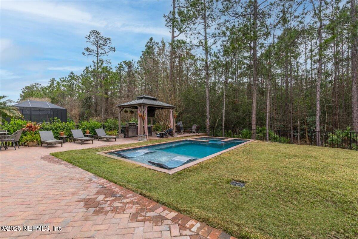 1047 Eagle Point Drive St. Augustine, FL 32092 - Photo 54 of 85 a view of a house with swimming pool and sitting area