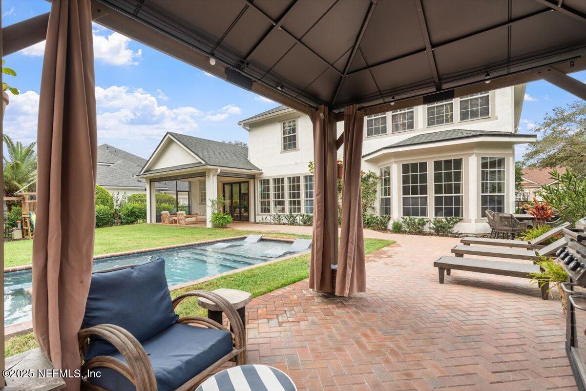 1047 Eagle Point Drive St. Augustine, FL 32092 - Photo 57 of 85 a view of a patio with couches chairs and potted plants