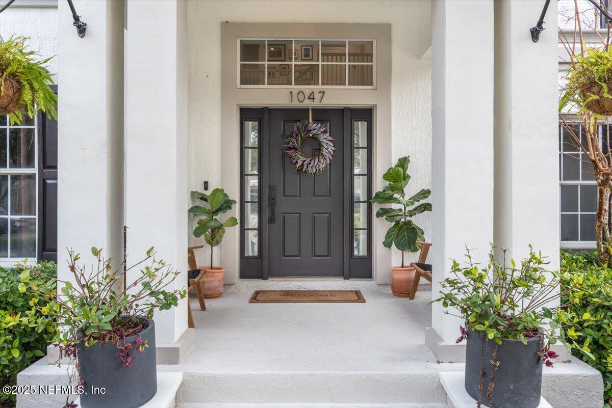 1047 Eagle Point Drive St. Augustine, FL 32092 - Photo 6 of 85 a front view of a house with a potted plant