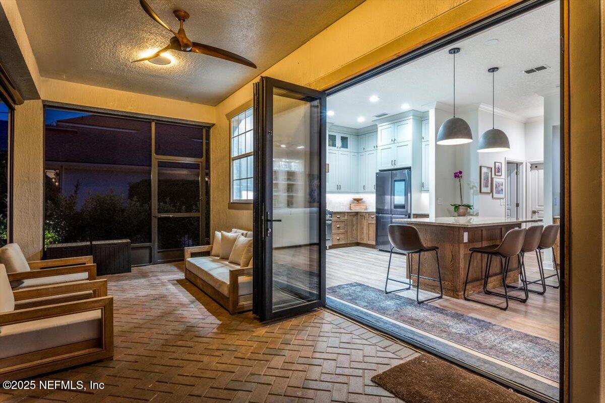 1047 Eagle Point Drive St. Augustine, FL 32092 - Photo 62 of 85 a view of a dining room with furniture wooden floor and a rug