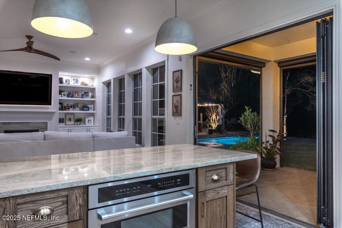 1047 Eagle Point Drive St. Augustine, FL 32092 - Photo 63 of 85 a kitchen with a counter space a sink and cabinets