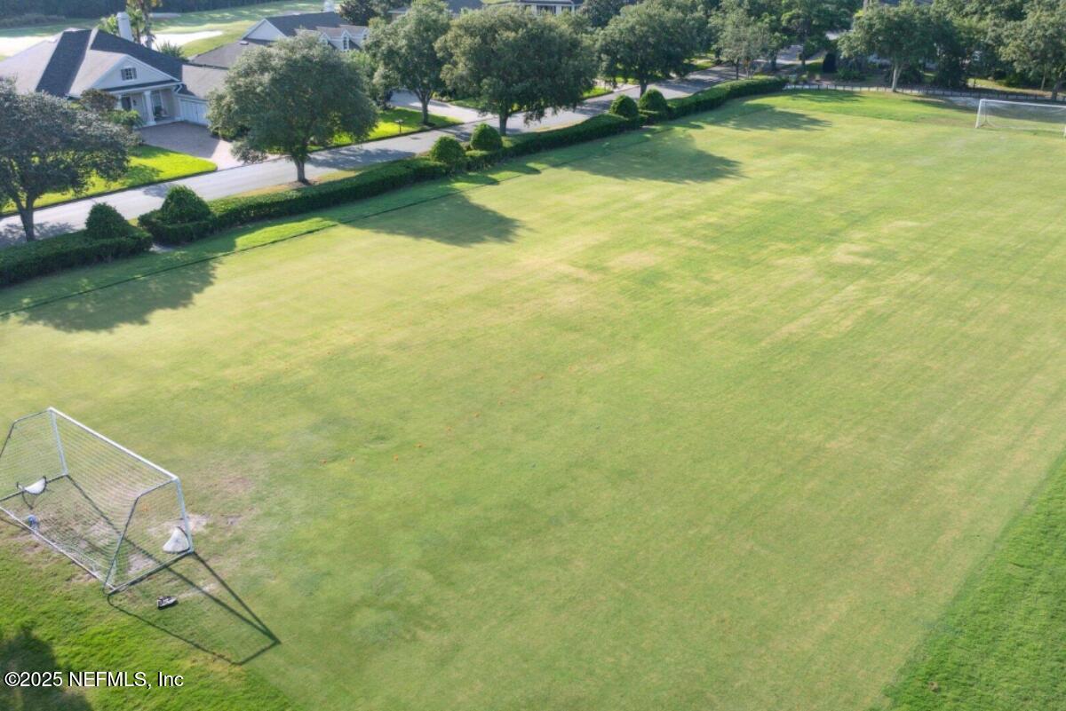1047 Eagle Point Drive St. Augustine, FL 32092 - Photo 78 of 85 a view of a swimming pool with an outdoor space and seating area