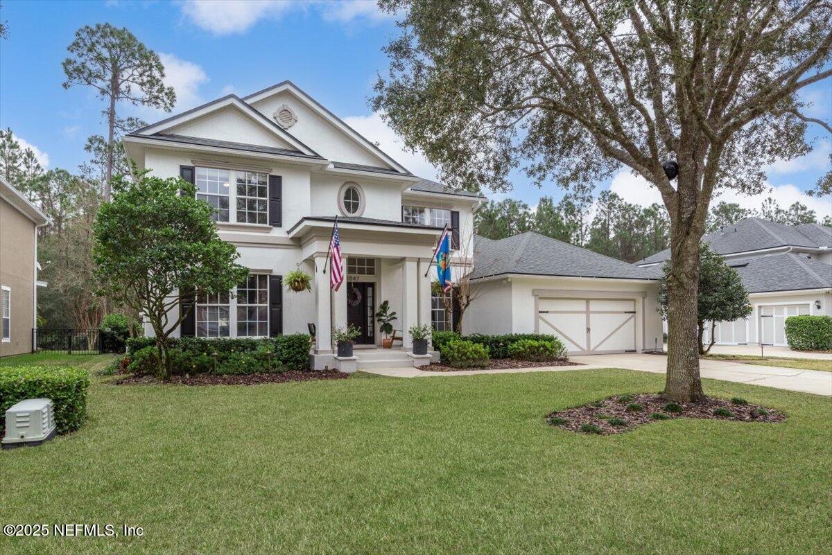 1047 Eagle Point Drive St. Augustine, FL 32092 - Photo 85 of 85 a front view of a house with a yard and trees