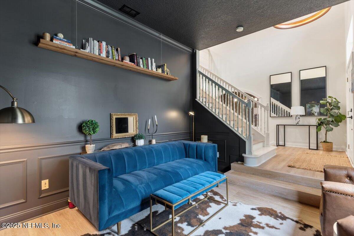 1047 Eagle Point Drive St. Augustine, FL 32092 - Photo 9 of 85 a living room with furniture and a book shelf
