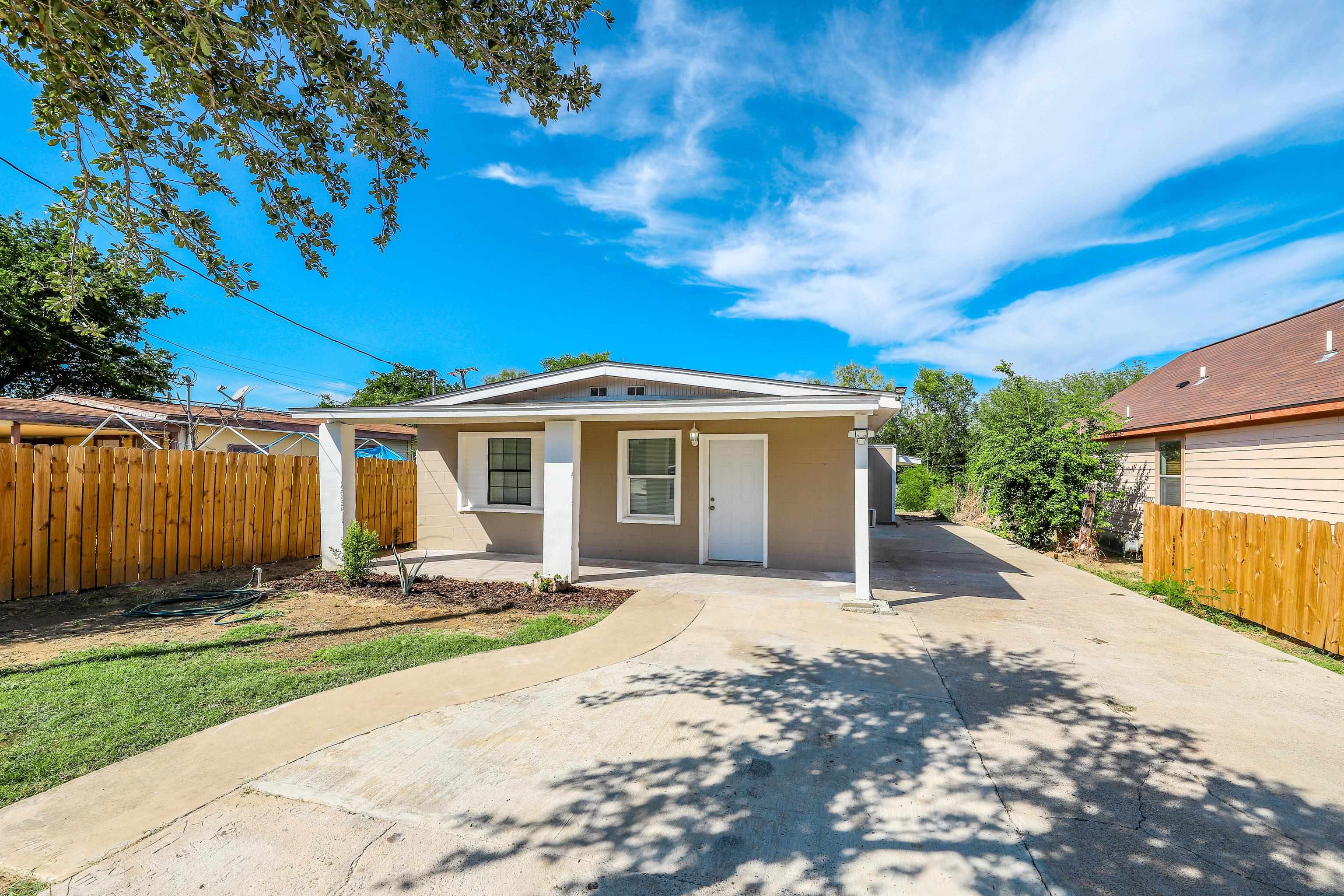 904 East Montgomery Street Laredo, TX 78040 - Photo 1 of 1 a front view of a house with a yard