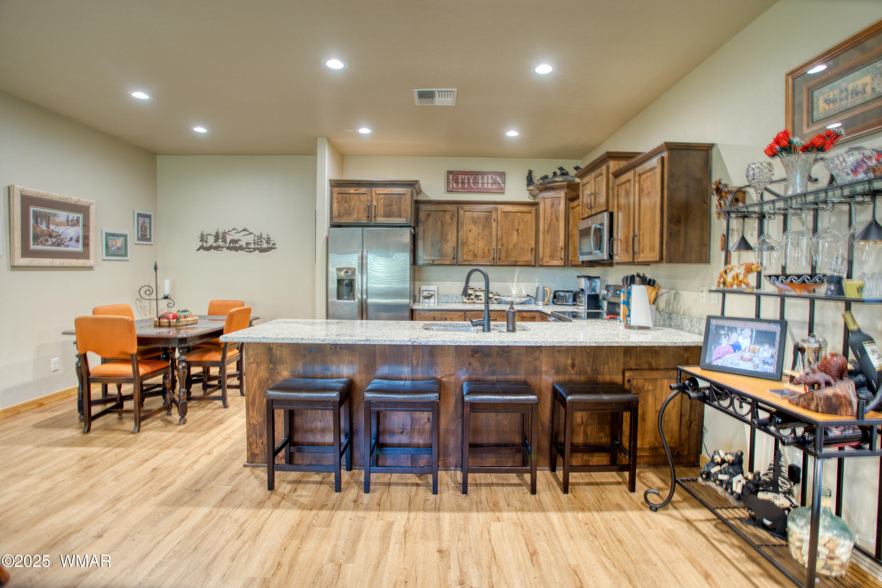 5863 Apollo Way Lakeside, AZ 85929 - Photo 6 of 16 a dining hall with stainless steel appliances granite countertop a dining table chairs and granite counter tops