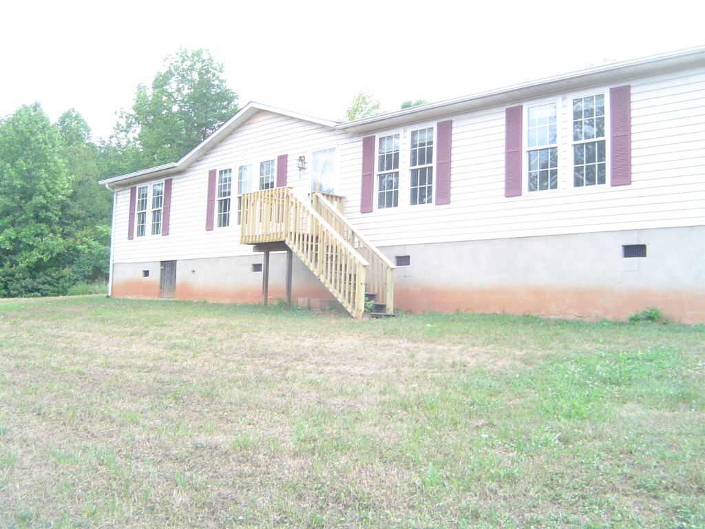 5728 Saunders Road Vinton, VA 24179 - Photo 1 of 1 a front view of a house with a yard