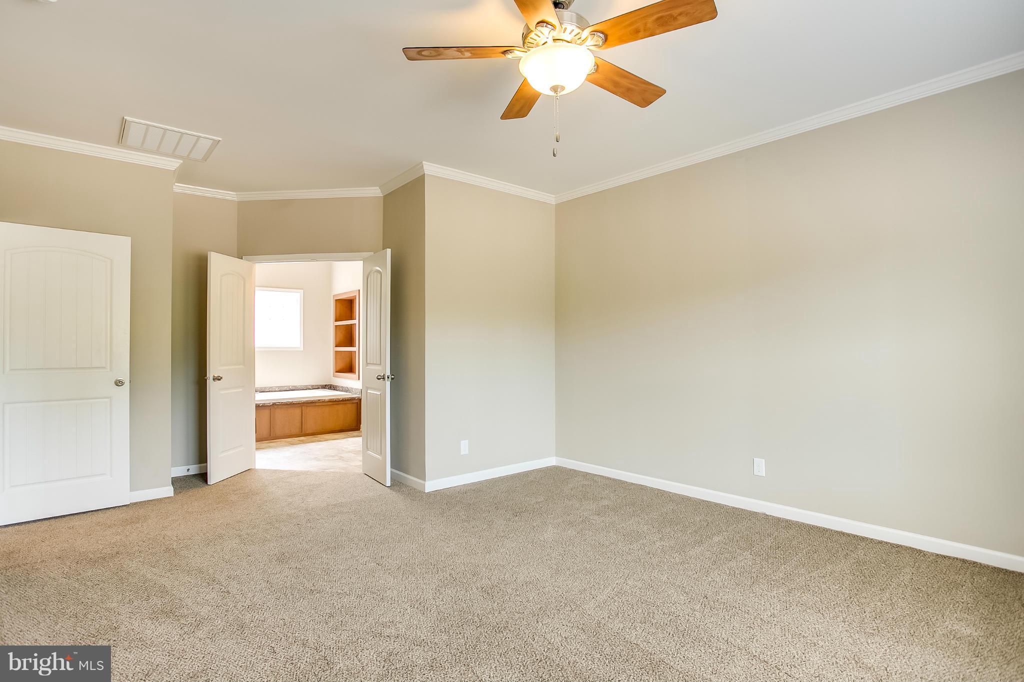 10421 Edenton Road Partlow, VA 22534 - Photo 3 of 18 a view of a room with a ceiling fan and entryway