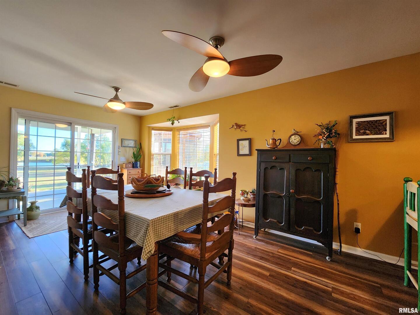 156 Hanover Lane Murphysboro, IL 62966 - Photo 12 of 63 a view of a dining room with furniture window and wooden floor