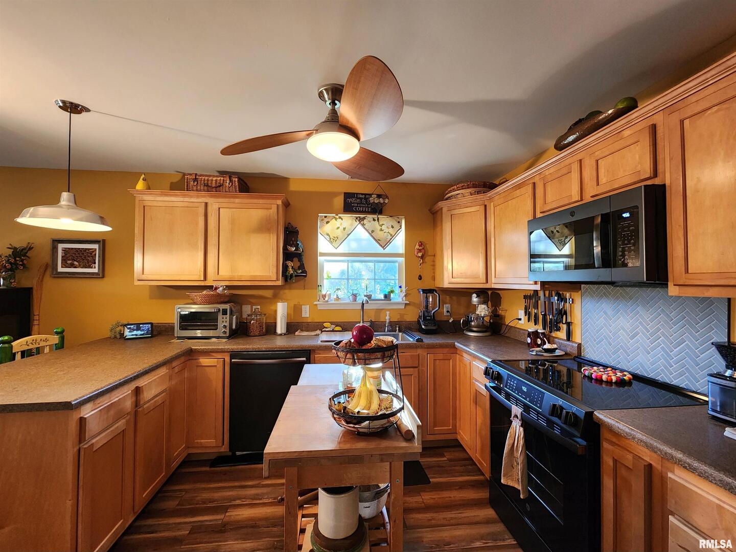 156 Hanover Lane Murphysboro, IL 62966 - Photo 16 of 63 a kitchen with a sink stove and microwave