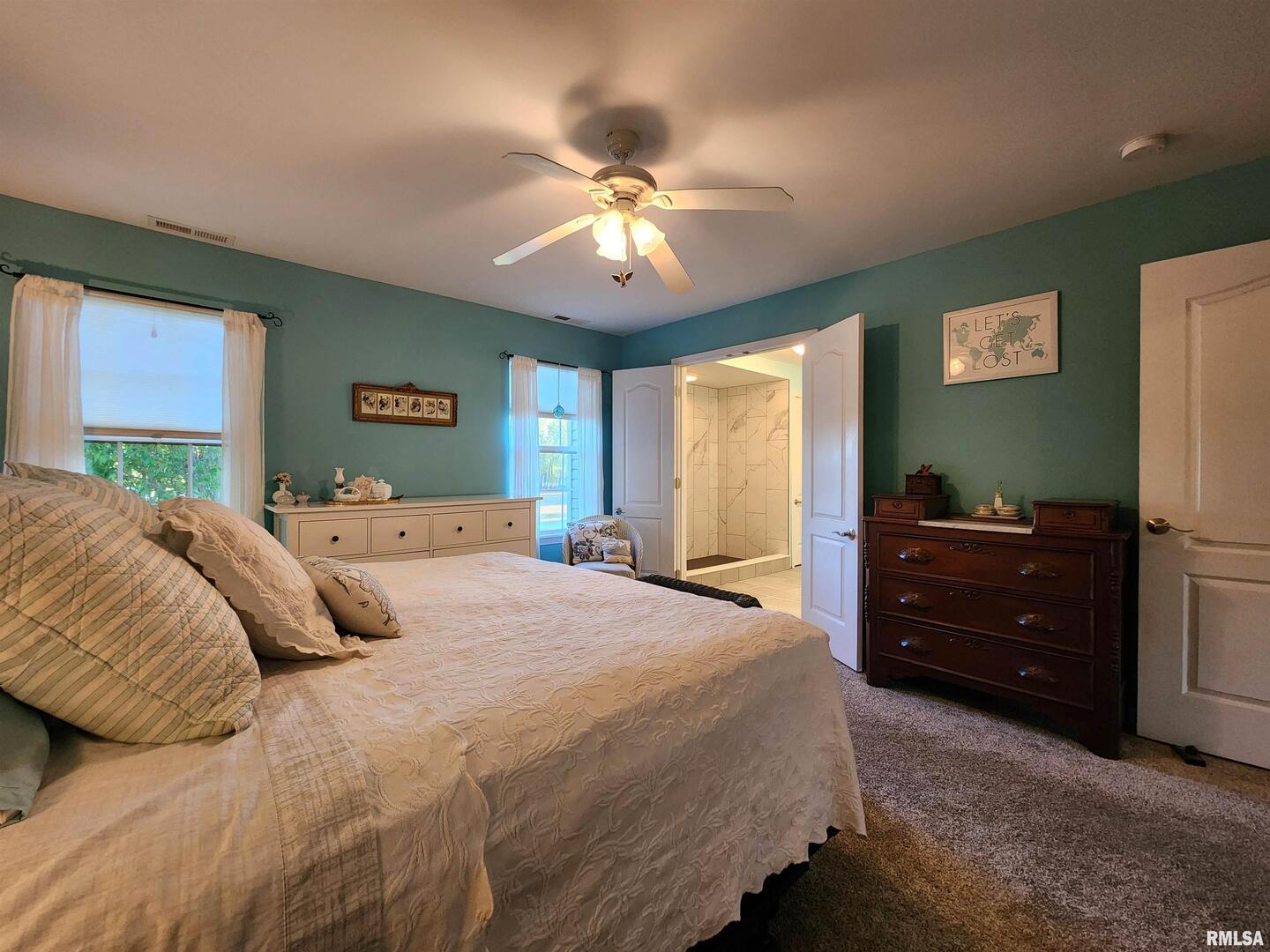 156 Hanover Lane Murphysboro, IL 62966 - Photo 26 of 63 a bedroom with a bed and a chandelier