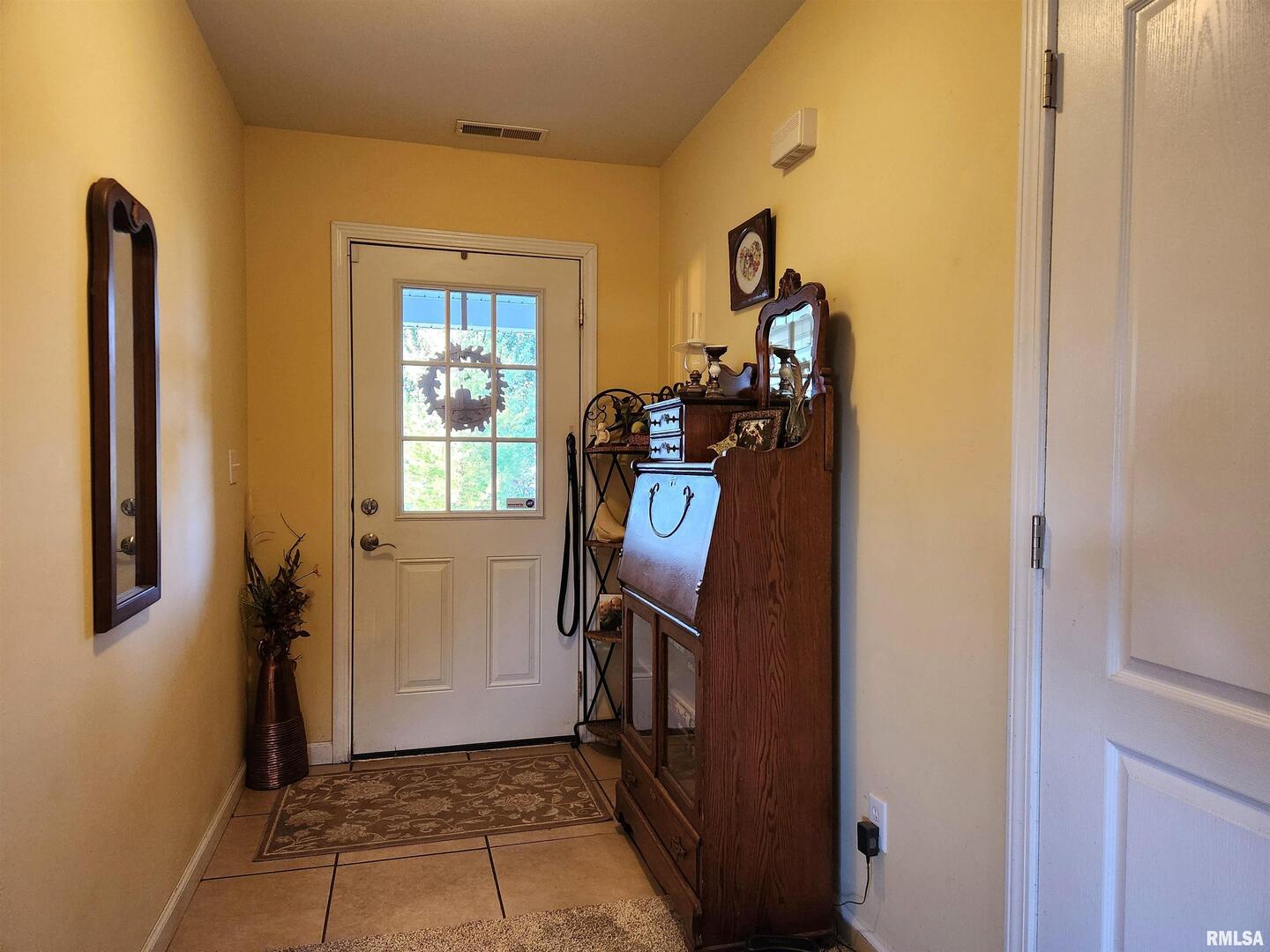 156 Hanover Lane Murphysboro, IL 62966 - Photo 41 of 63 a view of a hallway with wooden floor and a way to rooms