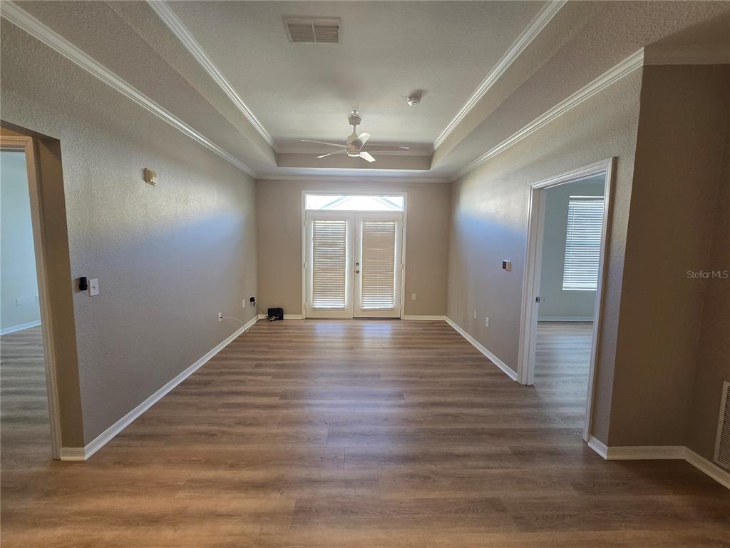 4221 West Spruce Street, Unit 2420 Tampa, FL 33607 - Photo 15 of 33 wooden floor in an empty room with a window