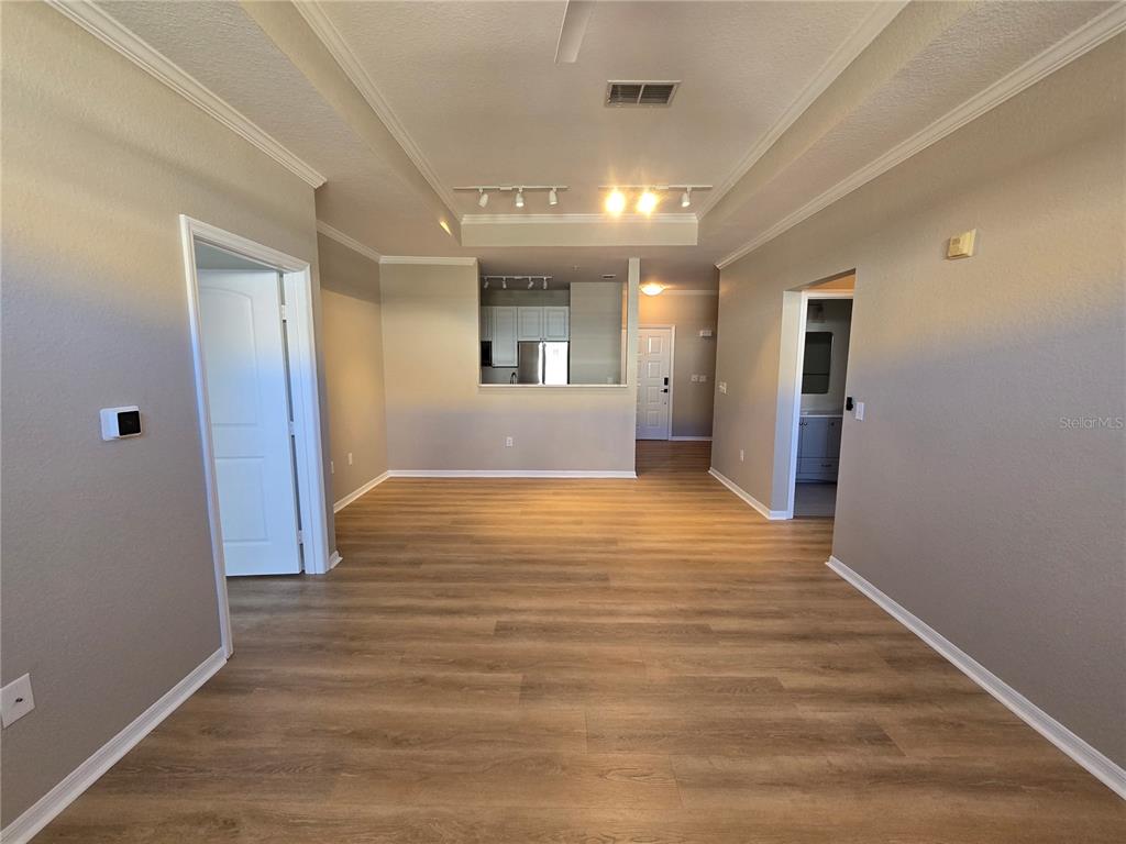 4221 West Spruce Street, Unit 2420 Tampa, FL 33607 - Photo 16 of 33 a view of an empty room with wooden floor and a window