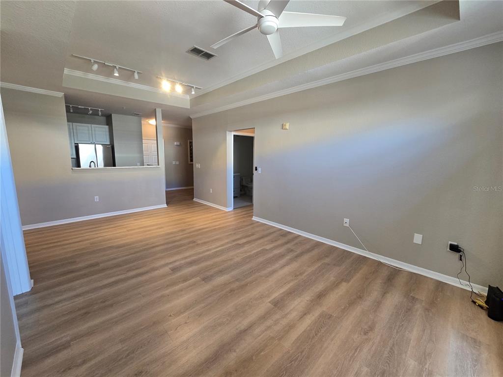 4221 West Spruce Street, Unit 2420 Tampa, FL 33607 - Photo 17 of 33 an empty room with wooden floor and windows