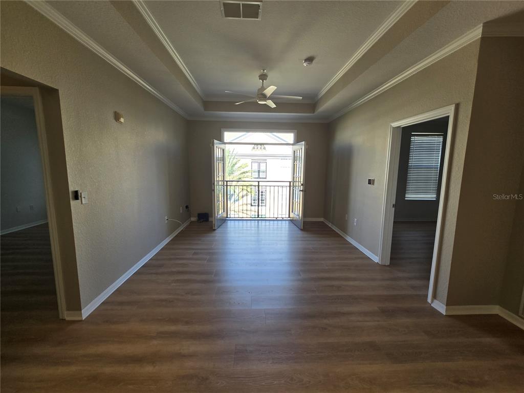 4221 West Spruce Street, Unit 2420 Tampa, FL 33607 - Photo 19 of 33 wooden floor in an empty room with a window