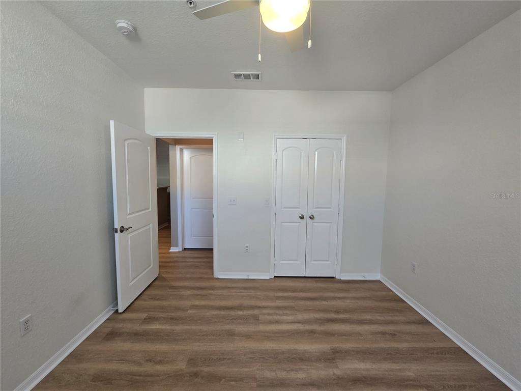 4221 West Spruce Street, Unit 2420 Tampa, FL 33607 - Photo 29 of 33 a view of a room with wooden floor and bathroom