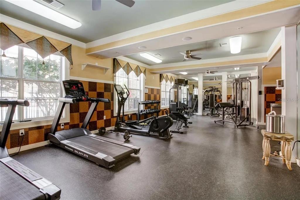 4221 West Spruce Street, Unit 2420 Tampa, FL 33607 - Photo 7 of 33 a view of a room with gym equipment