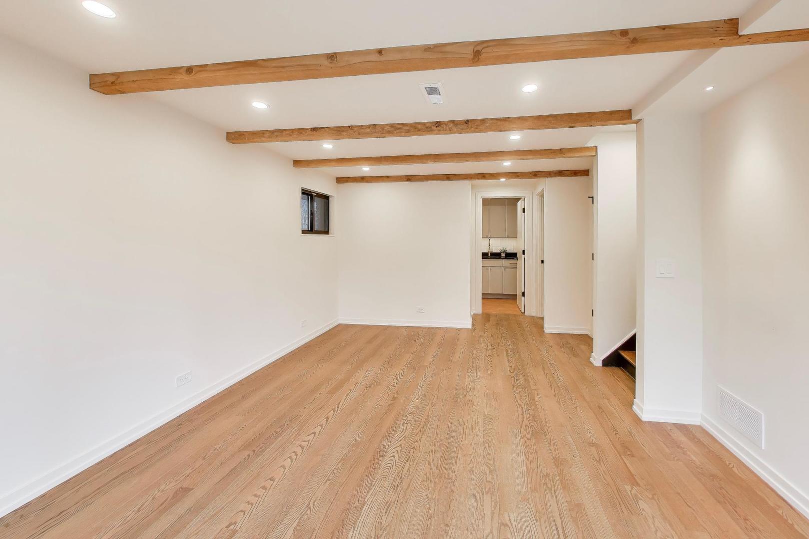 3530 Hillside Road Evanston, IL 60201 - Photo 15 of 27 a view of a room with wooden floor and staircase
