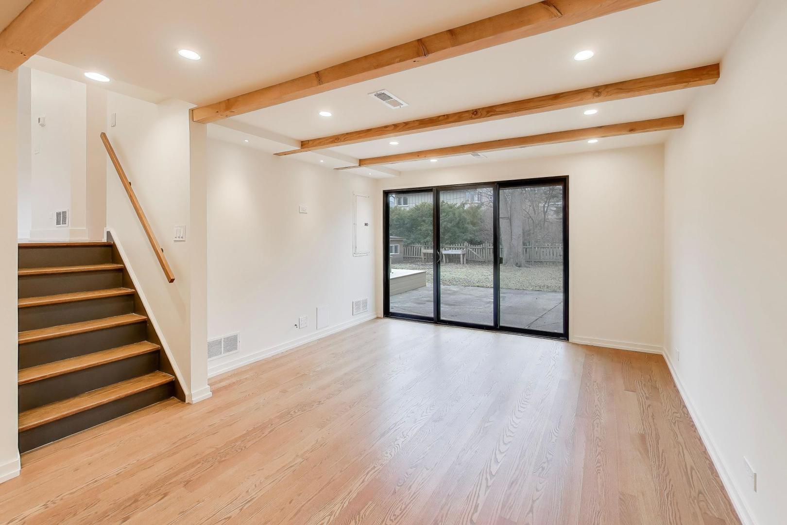 3530 Hillside Road Evanston, IL 60201 - Photo 17 of 27 an empty room with wooden floor and windows
