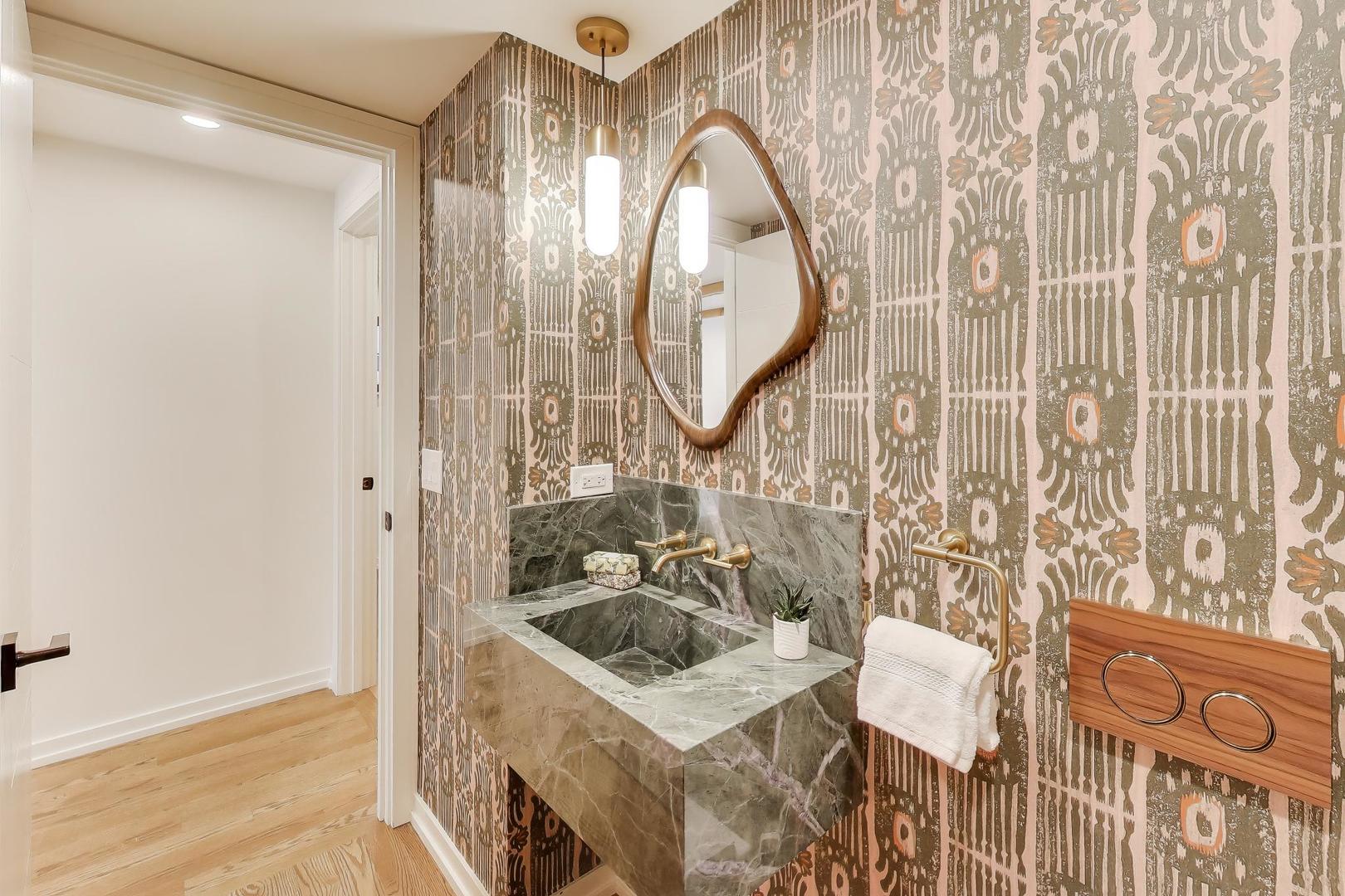 3530 Hillside Road Evanston, IL 60201 - Photo 18 of 27 a bathroom with a sink and a mirror