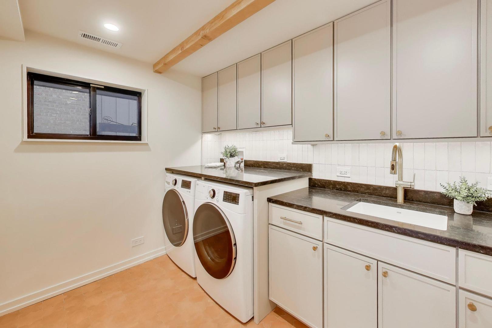 3530 Hillside Road Evanston, IL 60201 - Photo 19 of 27 a kitchen with granite countertop white cabinets and sink