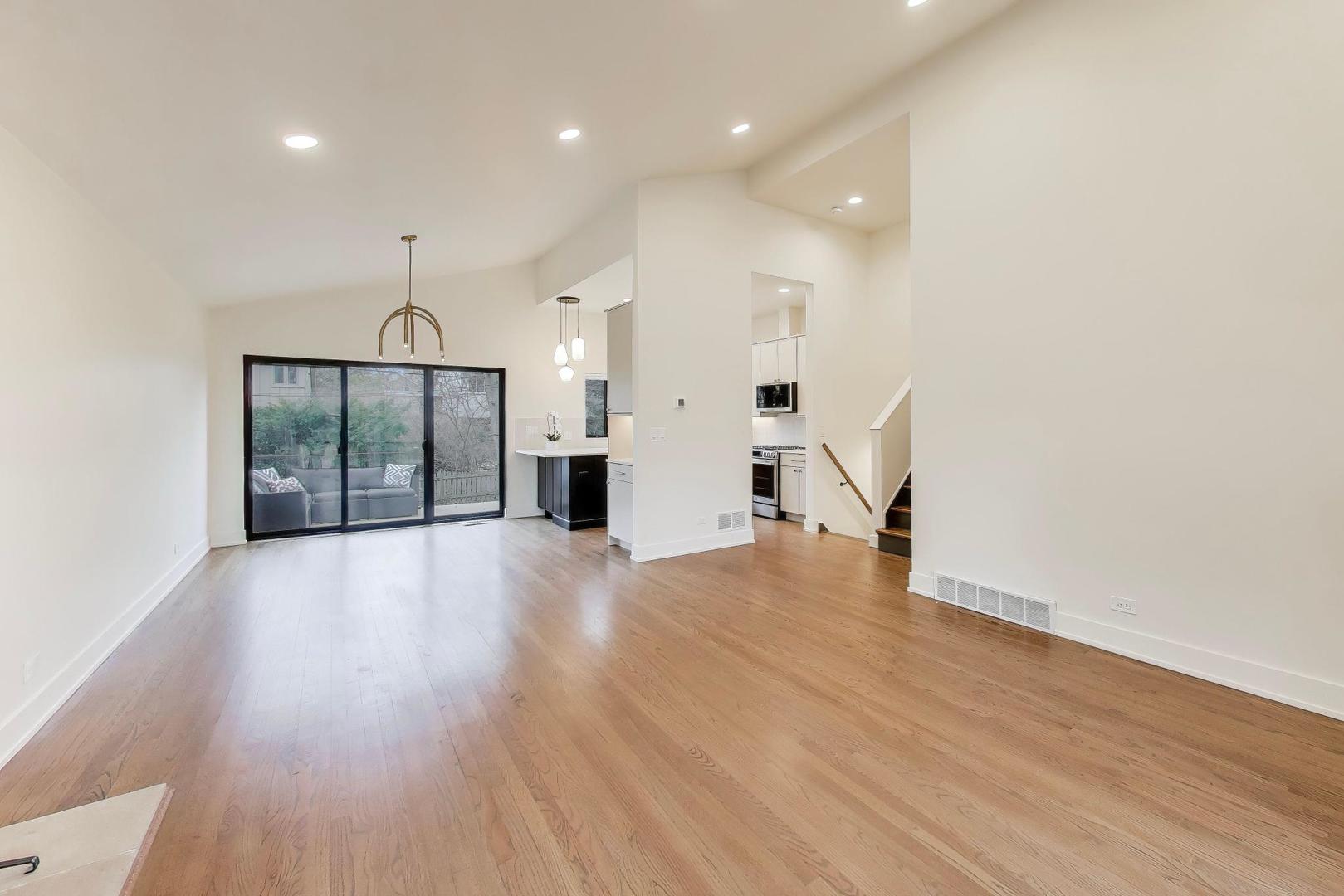 3530 Hillside Road Evanston, IL 60201 - Photo 3 of 27 a view of empty room with wooden floor and window