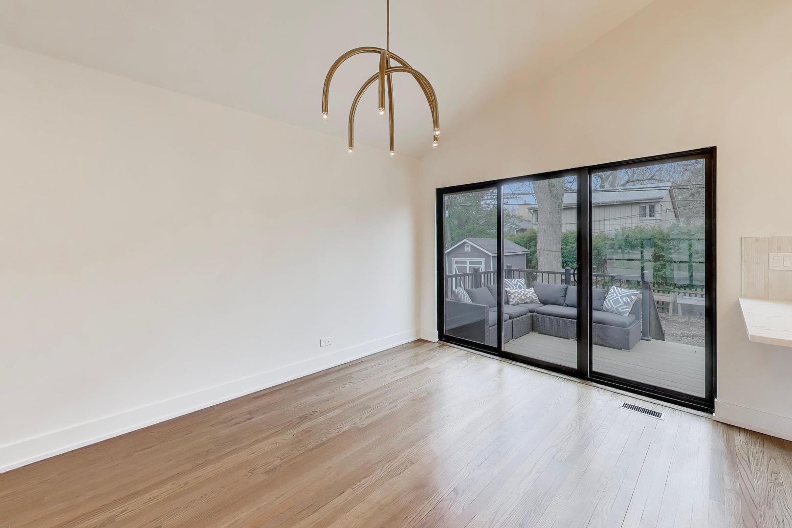 3530 Hillside Road Evanston, IL 60201 - Photo 5 of 27 a view of a room with wooden floor and window