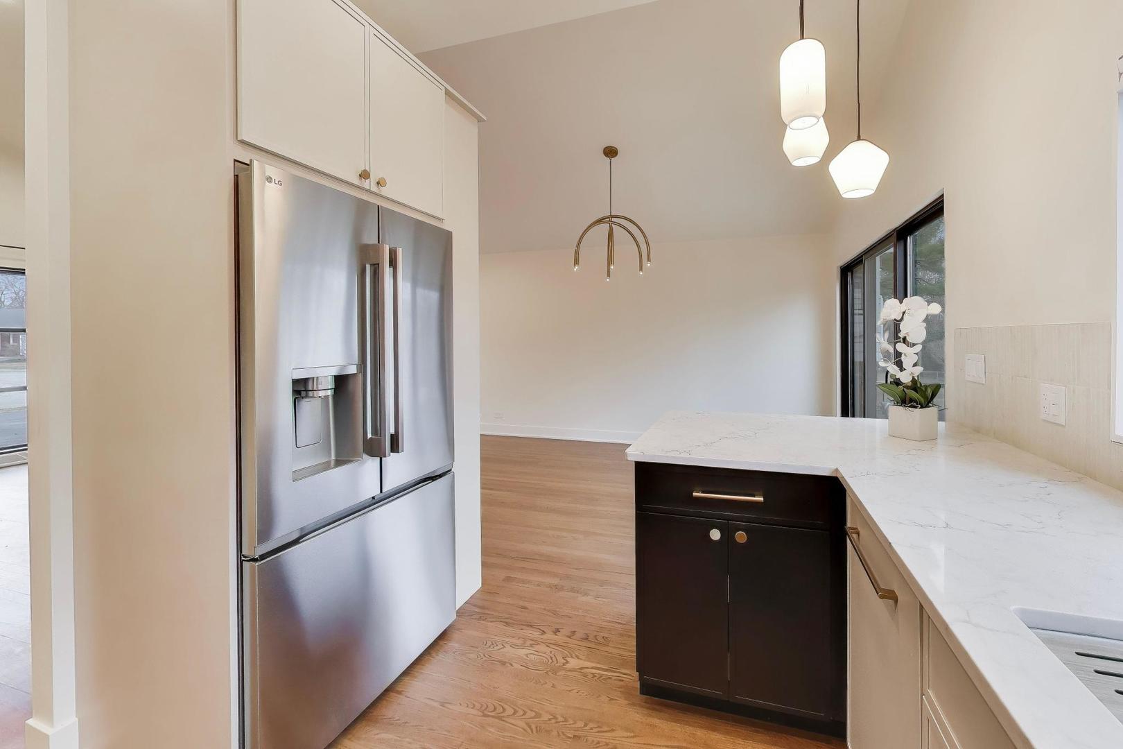 3530 Hillside Road Evanston, IL 60201 - Photo 9 of 27 a kitchen with a refrigerator and a sink