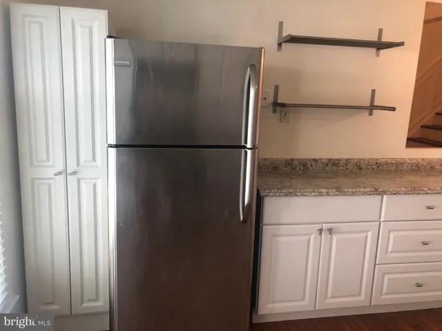 a close view of a refrigerator and window