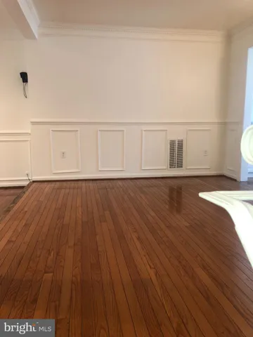 a view of wooden floor and brick walls