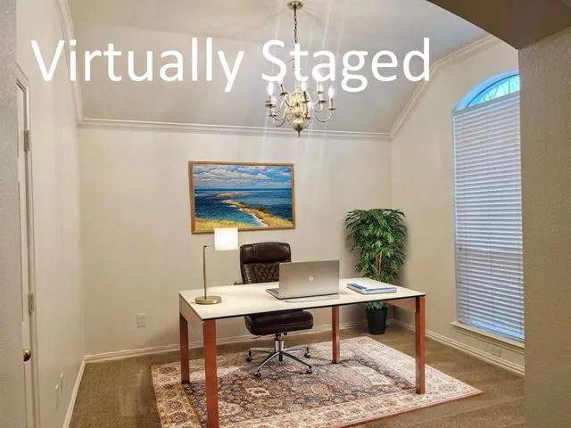 a view of a room with table and chairs