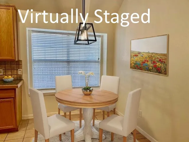 a view of a table and chairs in the kitchen
