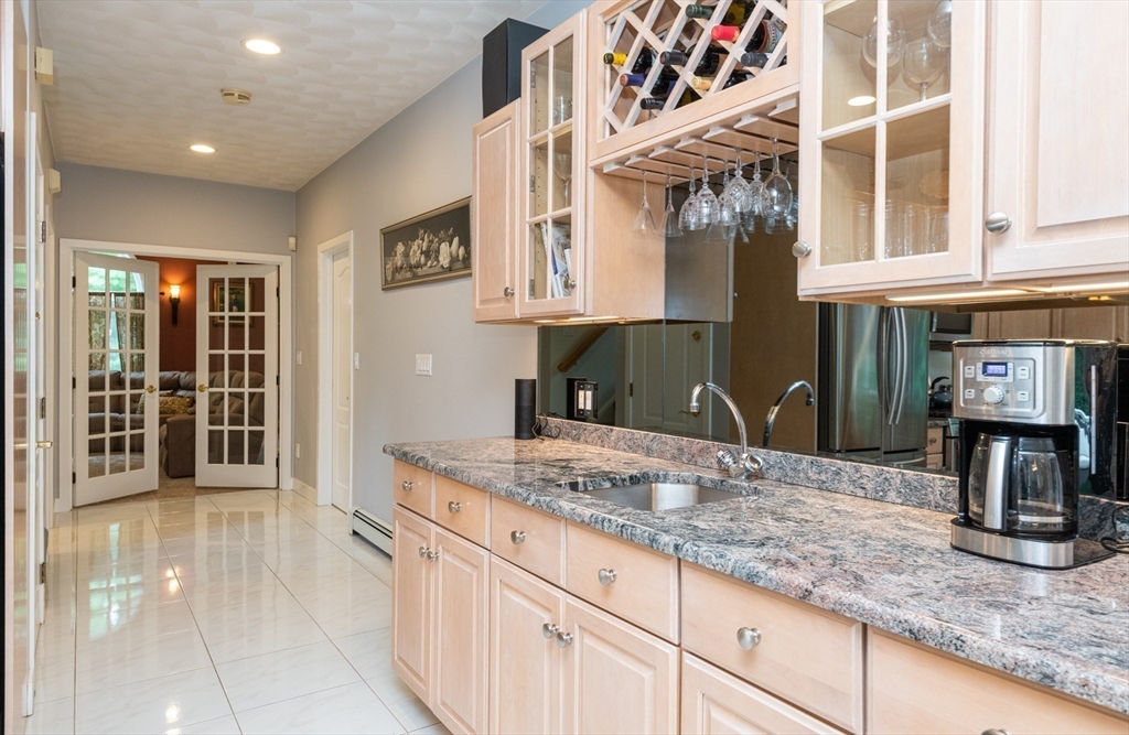 11 Hood Farm Road Ipswich, MA 01938 - Photo 18 of 42 a kitchen with stainless steel appliances granite countertop a sink stove and cabinets