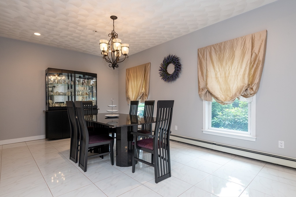 11 Hood Farm Road Ipswich, MA 01938 - Photo 19 of 42 a view of a dining room with furniture window and outside view