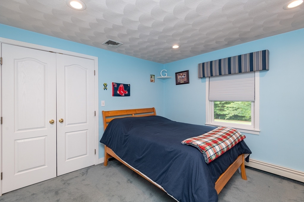 11 Hood Farm Road Ipswich, MA 01938 - Photo 23 of 42 a bedroom with a bed and a window