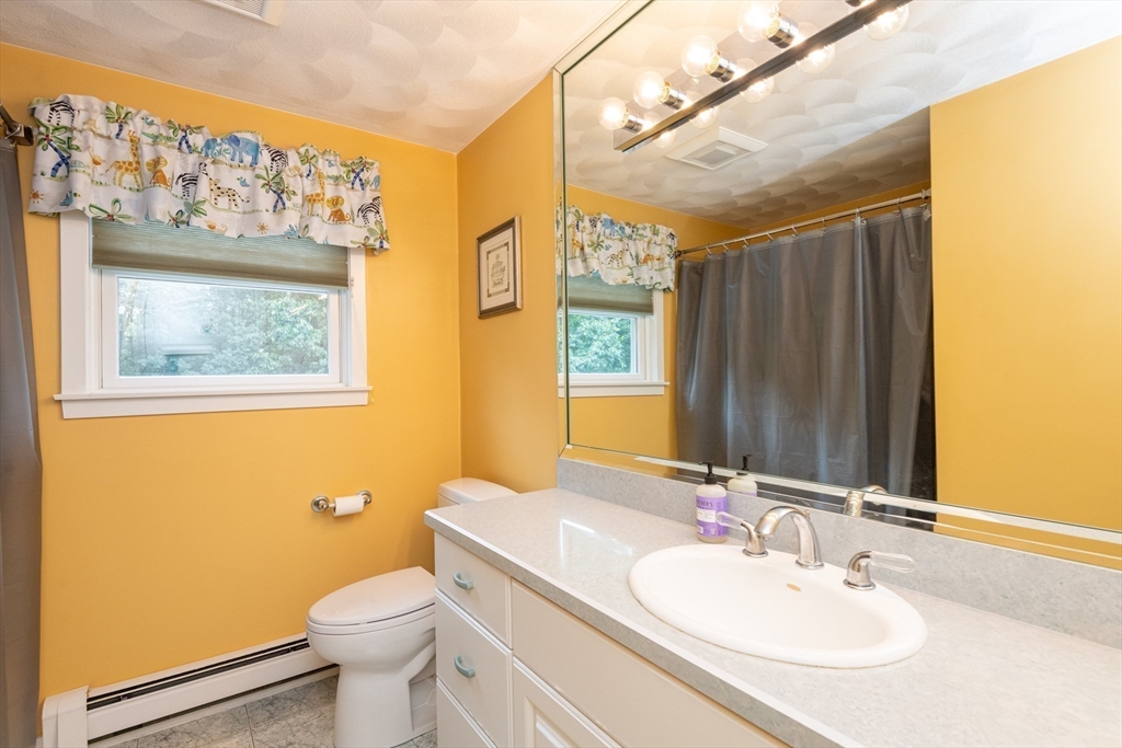 11 Hood Farm Road Ipswich, MA 01938 - Photo 24 of 42 a bathroom with a sink a toilet and mirror