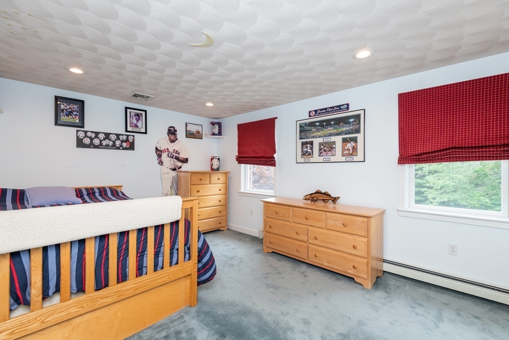11 Hood Farm Road Ipswich, MA 01938 - Photo 25 of 42 a bedroom with furniture and a baby crib