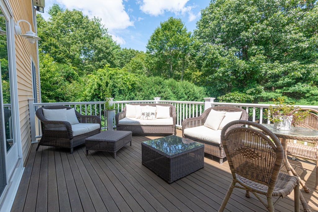 11 Hood Farm Road Ipswich, MA 01938 - Photo 35 of 42 a roof deck with couches and wooden floor