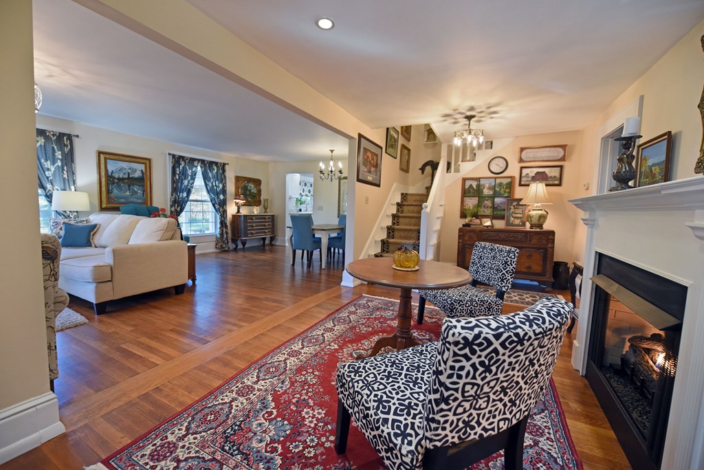 63 Loving Road Morganton, GA 30560 - Photo 7 of 58 a living room with furniture a rug and a fireplace