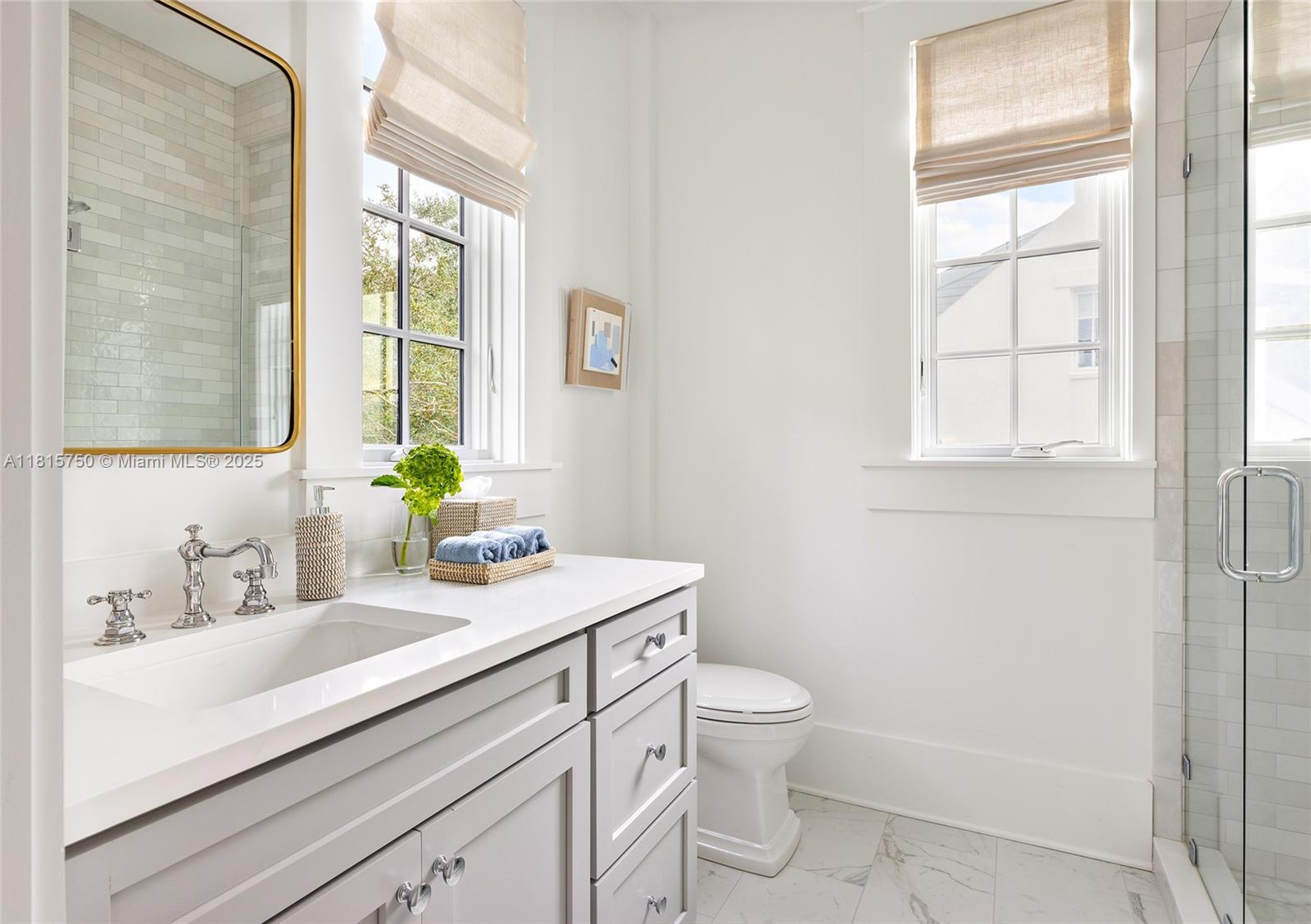 25 North Belize Lane Inlet Beach, FL 32461 - Photo 19 of 35 a bathroom with a sink a toilet and a window