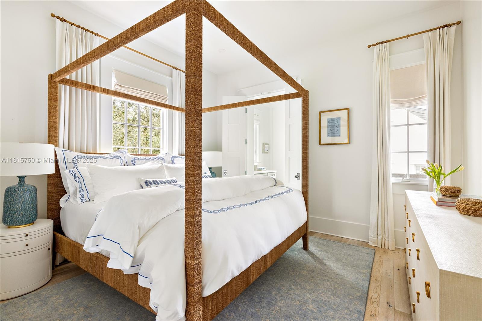 25 North Belize Lane Inlet Beach, FL 32461 - Photo 20 of 35 a bedroom with a bed and a potted plant