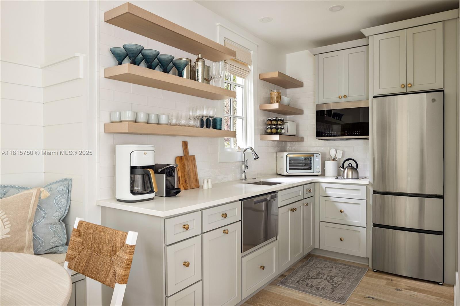 25 North Belize Lane Inlet Beach, FL 32461 - Photo 24 of 35 a kitchen with stainless steel appliances a refrigerator sink and cabinets