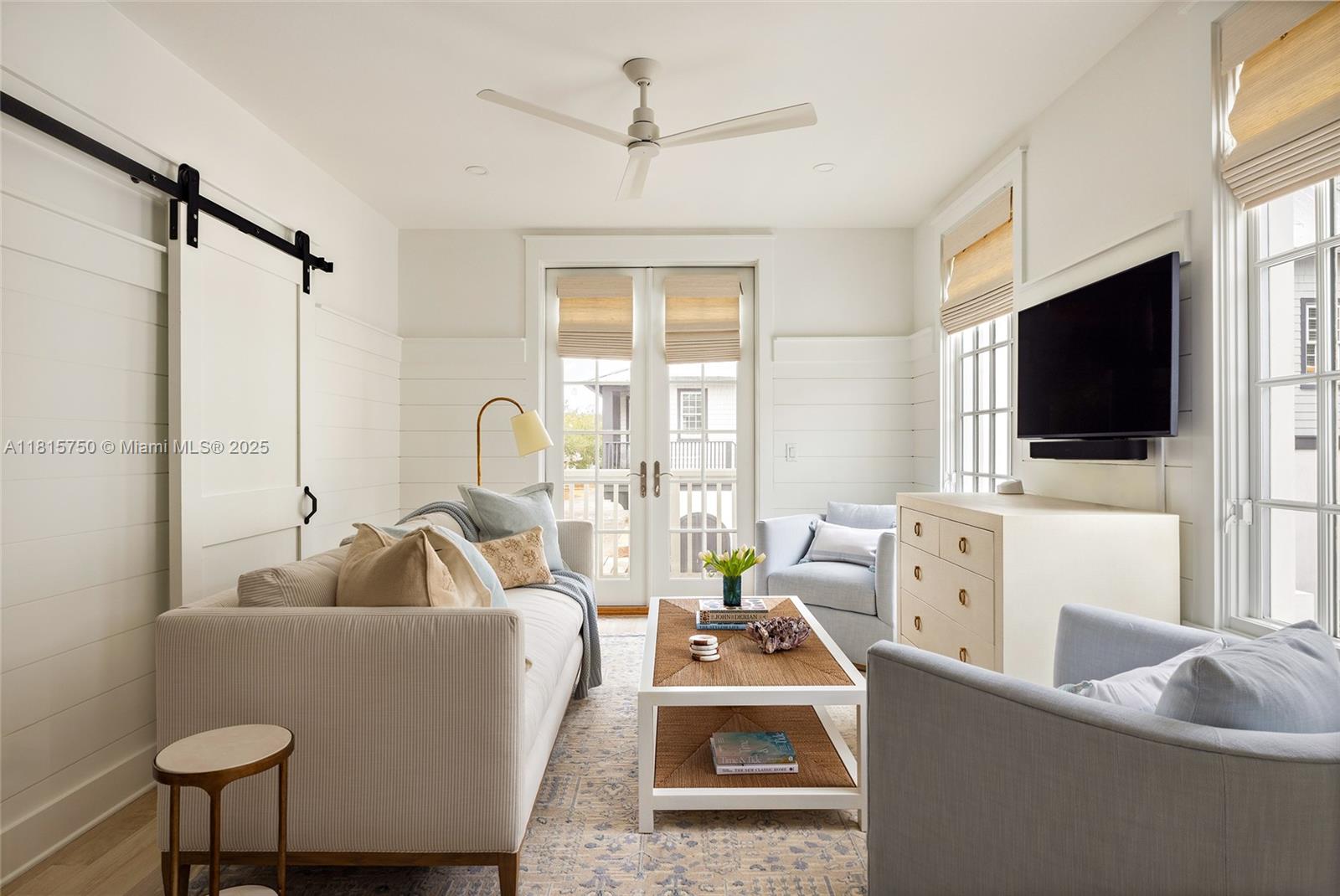 25 North Belize Lane Inlet Beach, FL 32461 - Photo 29 of 35 a living room with furniture and a flat screen tv