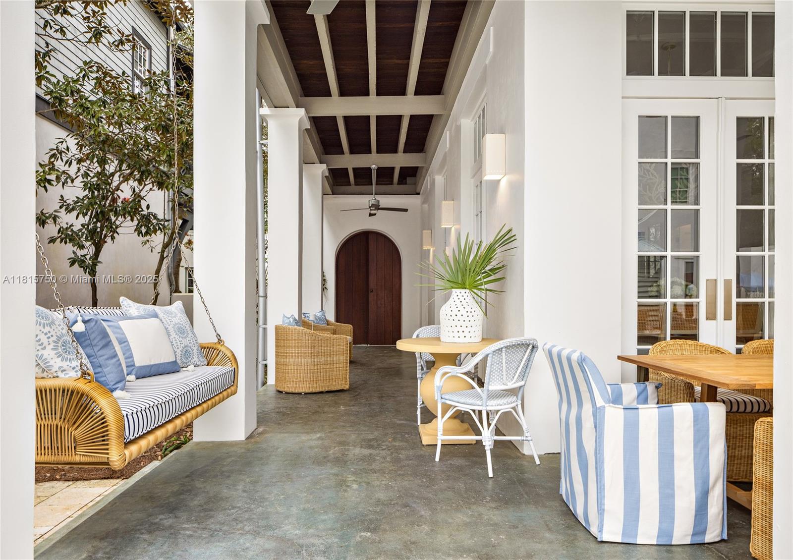 25 North Belize Lane Inlet Beach, FL 32461 - Photo 31 of 35 a view of a patio with couches table and chairs and potted plants
