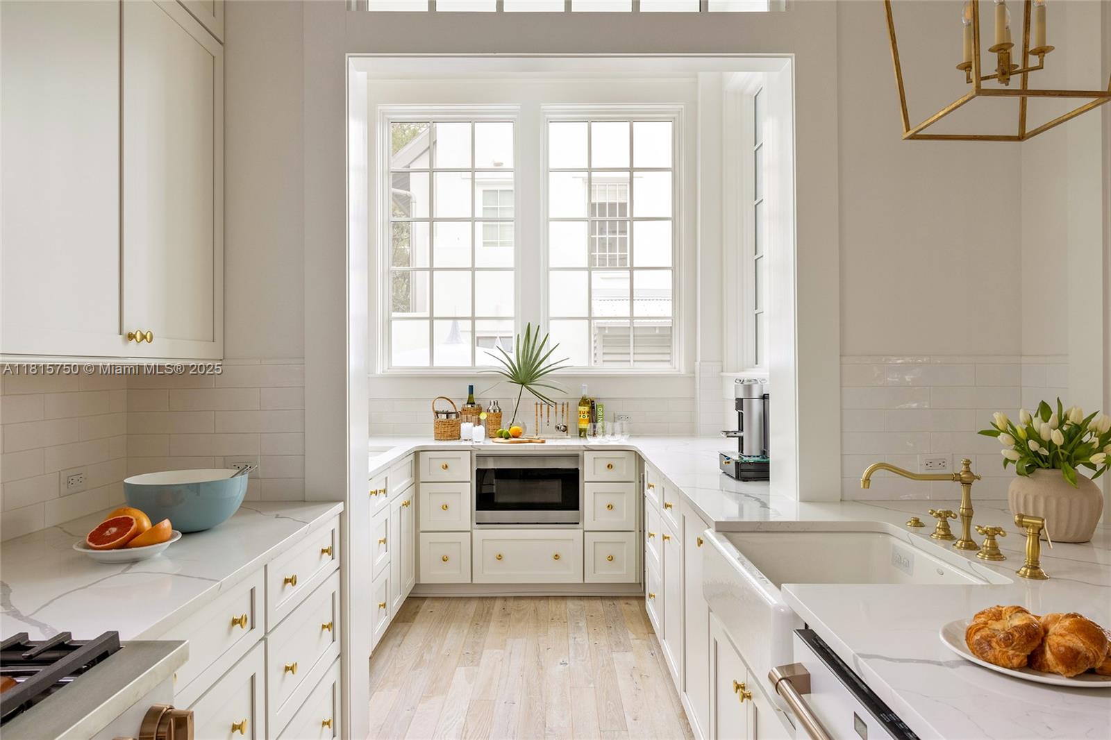 25 North Belize Lane Inlet Beach, FL 32461 - Photo 6 of 35 a kitchen with a sink a stove and cabinets