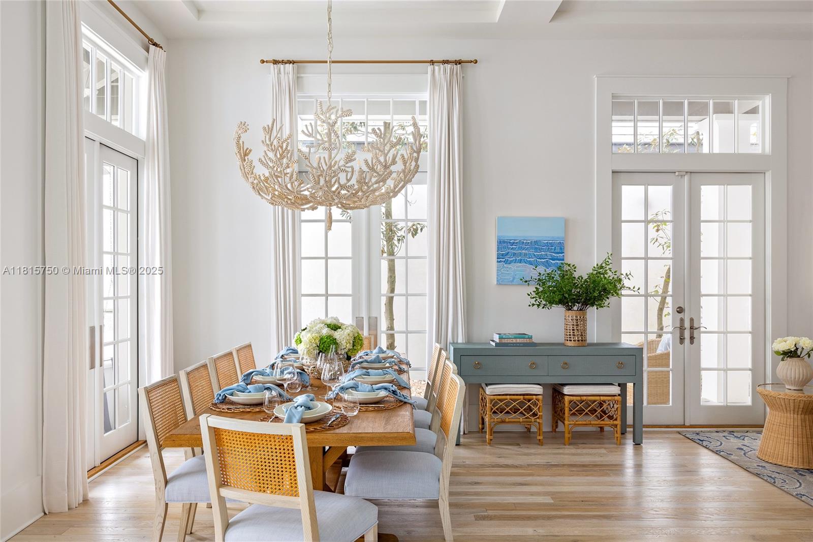 25 North Belize Lane Inlet Beach, FL 32461 - Photo 10 of 35 a living room with furniture a table and a chandelier