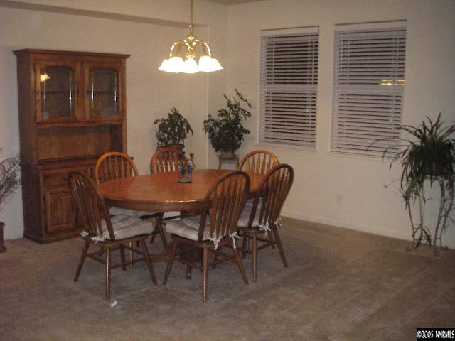 10898 Dancing Aspen Drive Reno, NV 89521 - Photo 2 of 6 a dining room with furniture and window