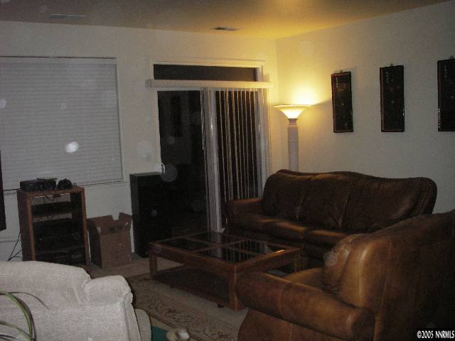 10898 Dancing Aspen Drive Reno, NV 89521 - Photo 4 of 6 a living room with furniture and a flat screen tv